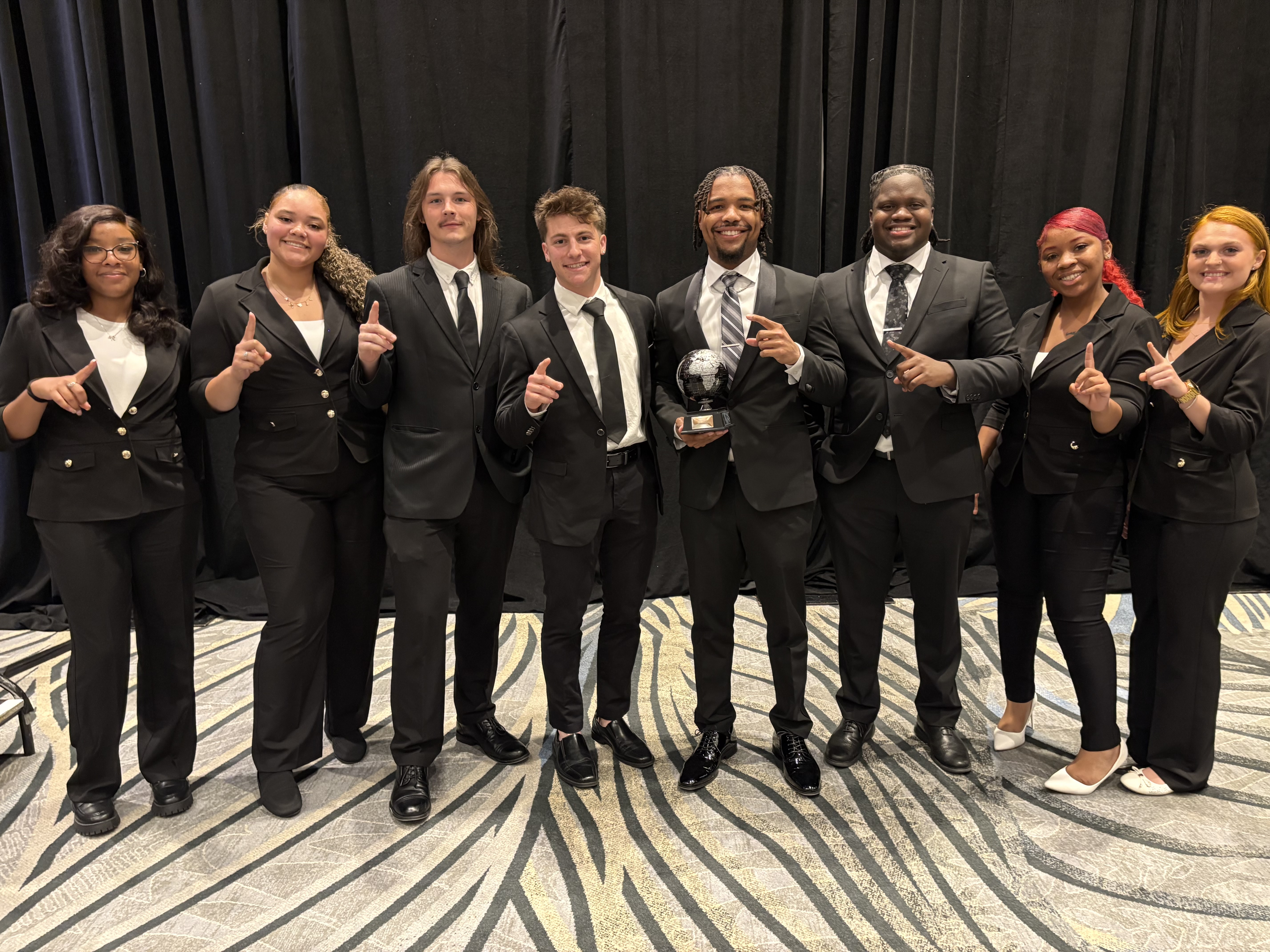 Ironwood West Michigan Group team celebrating an award on stage