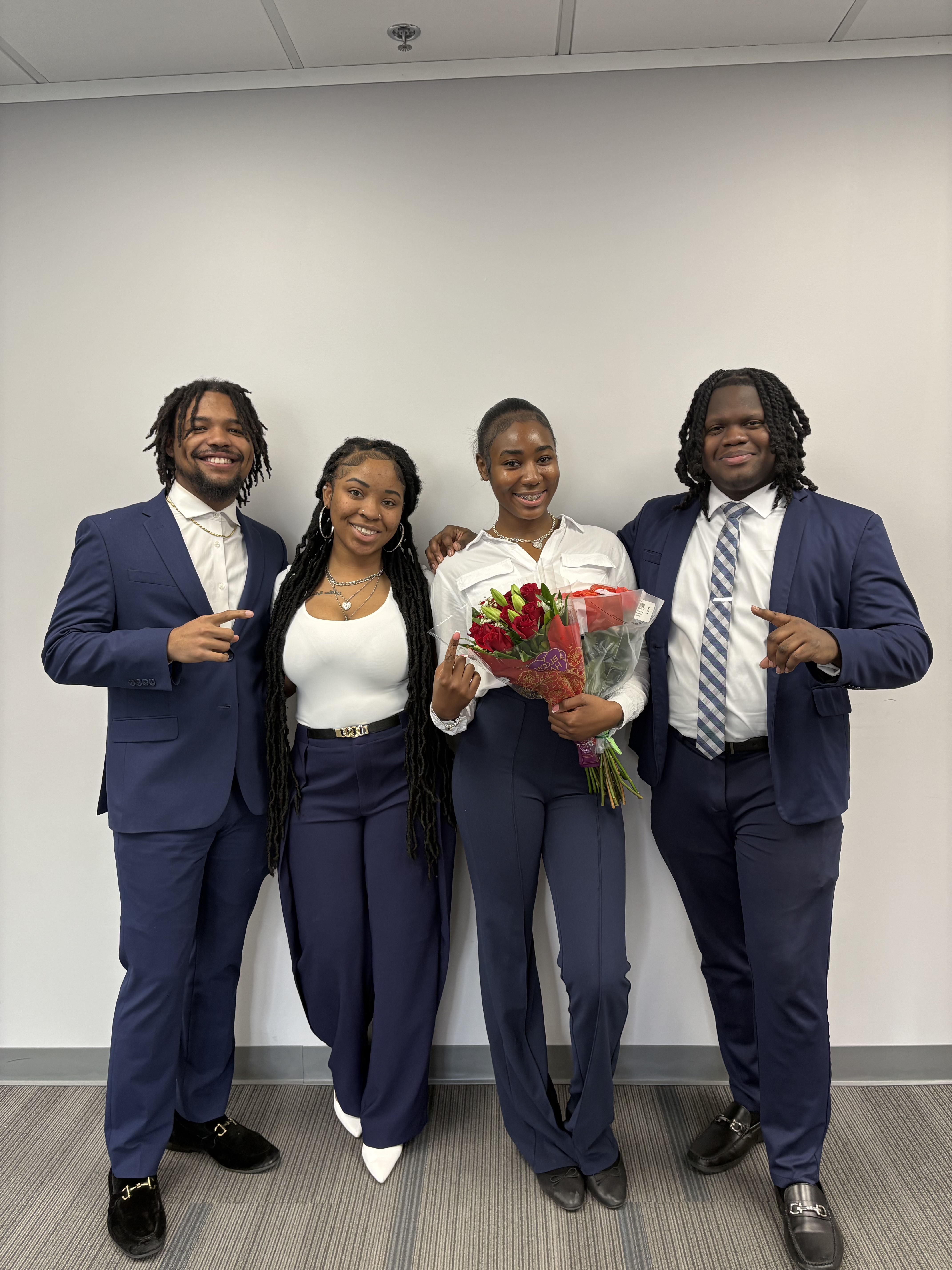 Ironwood West Michigan Group team in professional attire posing for a group photo